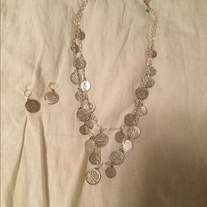 Joan Rivers coin necklace with earrings.